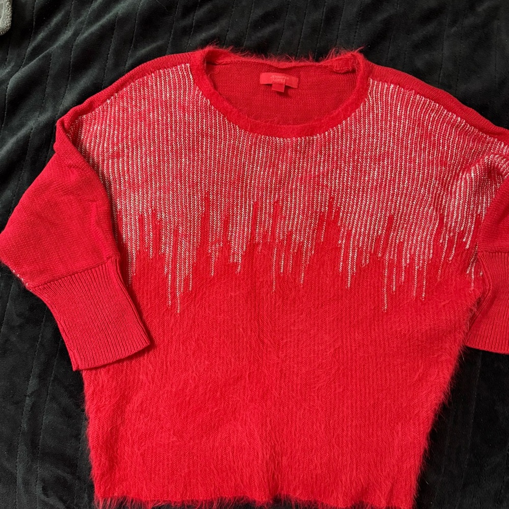 Jennifer Lopez Red Sweater with Silver Detailing